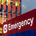 photo of hospital emergeny sign with hospital builing in background